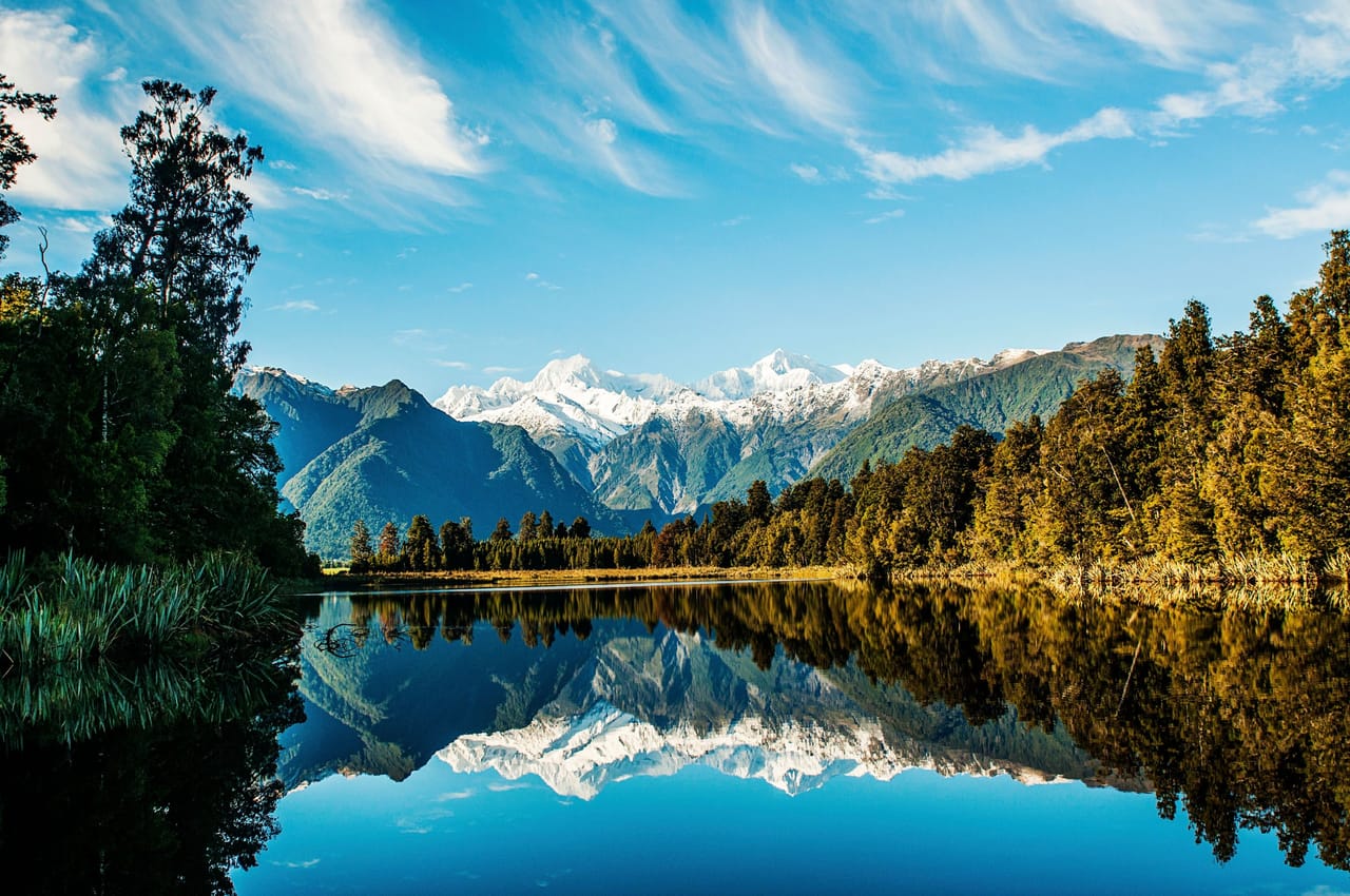 Lake Matheson, New Zealand, reflecting the Southern Alps